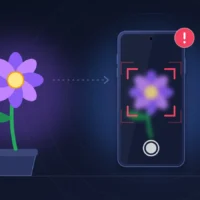 Smartphone iPhone 18 Pro photographiant une fleur dont l'image à l'écran reste floue