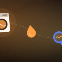 Lave-linge à hublot avec une goutte d'eau et une loupe, diagnostic d'une vidange bloquée