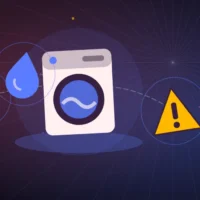 Lave-linge à hublot avec une goutte d'eau, un panneau d'alerte et une clé